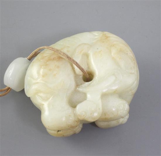 A Chinese pale celadon and russet jade figure of an elephant, 18th century, length 4.6cm